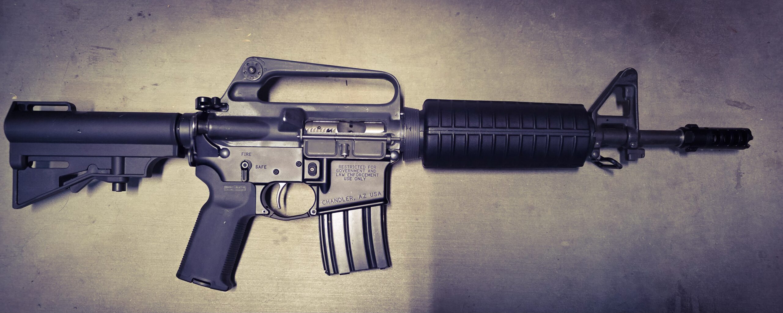 Spotless, reassembled AR-15 rifle on a shooting bench, symbolizing reliable performance after thorough maintenance.